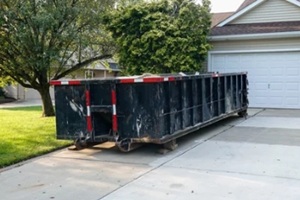 dumpster in the driveway