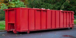 metal trash construction garbage dumpster on the house renovation