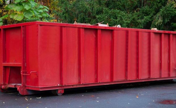 metal trash construction garbage dumpster on the house renovation