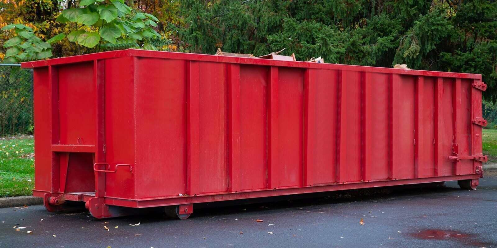 metal trash construction garbage dumpster on the house renovation