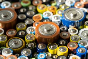 Close up of positive ends of discharged batteries of different s