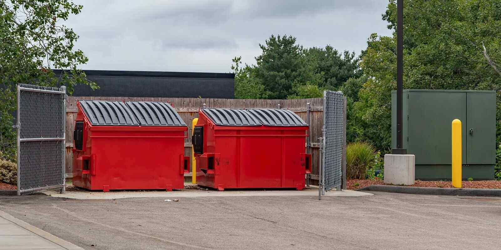 large red commercial dumpster for trash and recycling