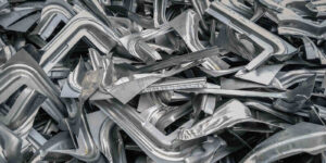 pile of industrial scrap metal pieces from manufacturing press machine process