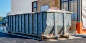 commercial dumpster next to new fast food store construction